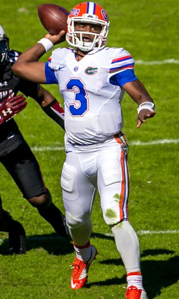 Gators withstand Gamecocks’ 4th-quarter rally, keep playoff hopes alive